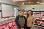 Photo of Aphra in front of the Butchery at Rose Farm Shop